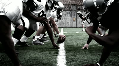 stock-footage-the-defensive-and-offensive-lines-of-two-football-teams-meet-at-the-line-of-scrimmage-high